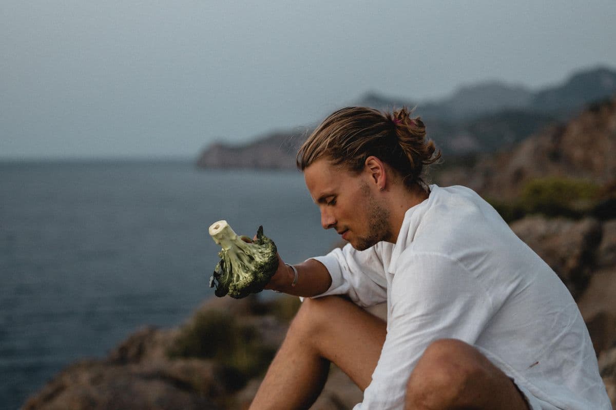 David with fresh produce by the sea