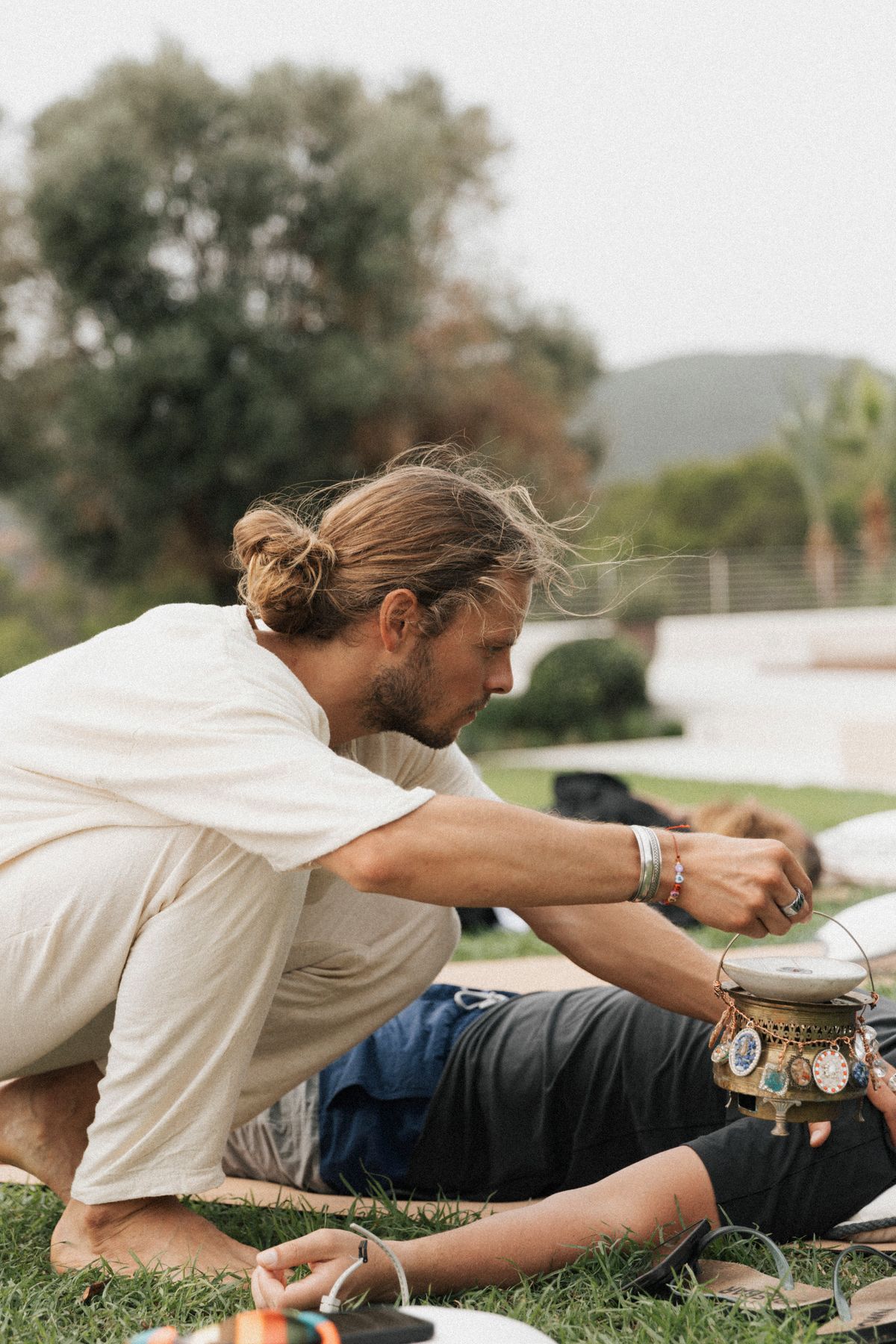 David holding space with a singing bowl during breathwork, Ibiza 2024